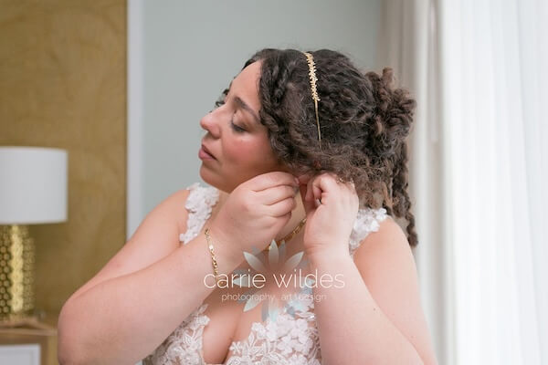 Wyndham Grand Clearwater Beach bride dressing for her wedding.