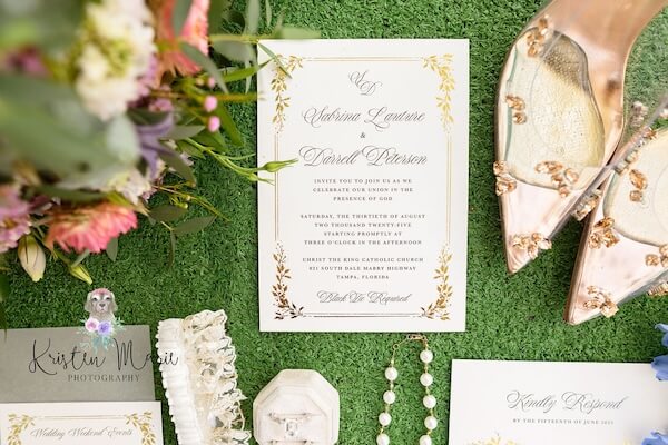 Flaylay photo of a Tampa bride's wedding invitation and accessories.