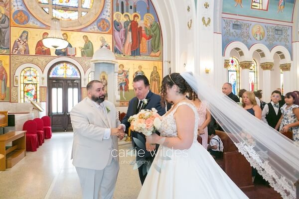 A bride and groom in St. Nicholas Greek Orthodox Church in Tarpon Springs, Florida.