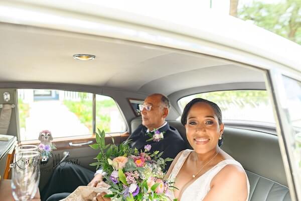 A Tampa bride and her father heading to the church in a 1961 Bentley II.