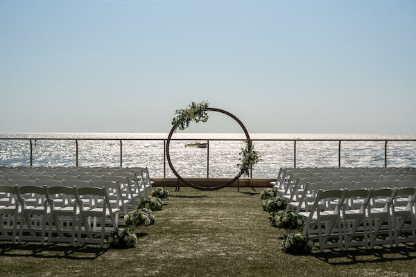 Wedding ceremony decor on the Opal Sands wedding lawn.