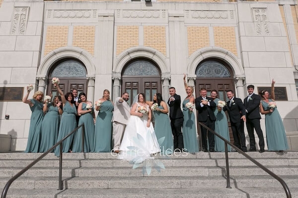 Newlyweds with thier weding party outside of St. Nicholas Greek Orthodox Church in Tarpon Springs, Florida.