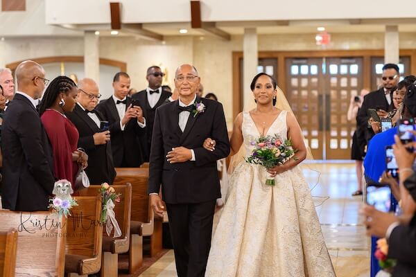 A Tampa bride and her father walking down the aisle.