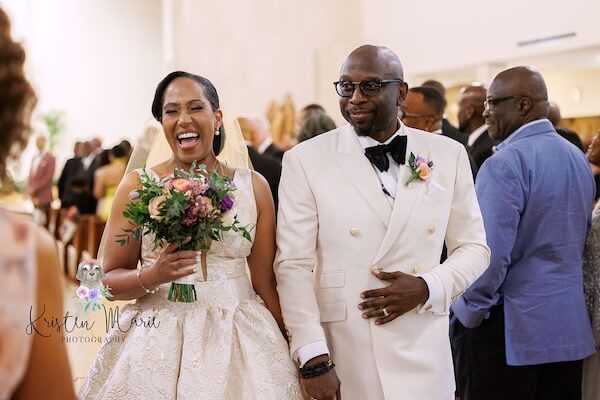 A newlyed couple exiting thier Tampa wedding ceremony.