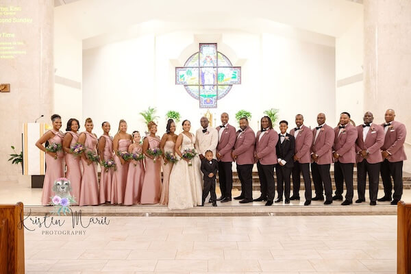Wedding party photos in the sanctuary of Christ the King Catholic Church in Tampa.