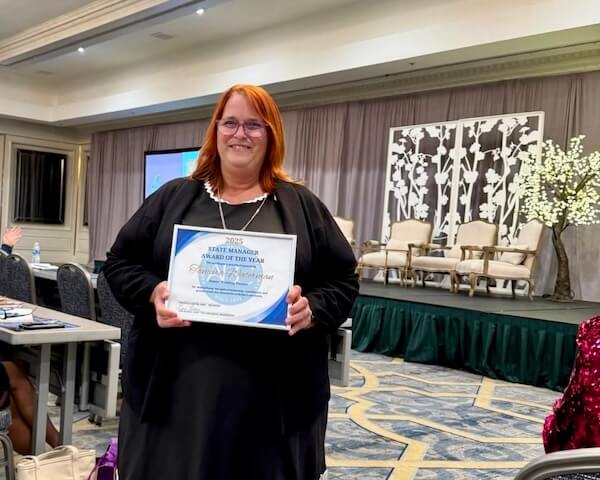 Master Wedding Planner Tammy Waterman winning State Manager of the Year 2025